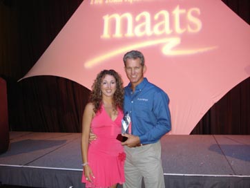 picture of Jeff and fiance accepting the NMMA award