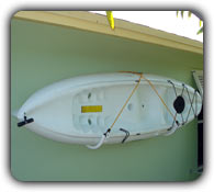single kayak shack rack mounted on a wall
