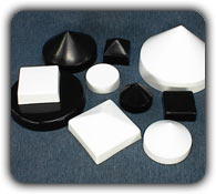 various sizes of white and black dock piling caps