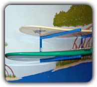 double sup board rack mounted on a wall